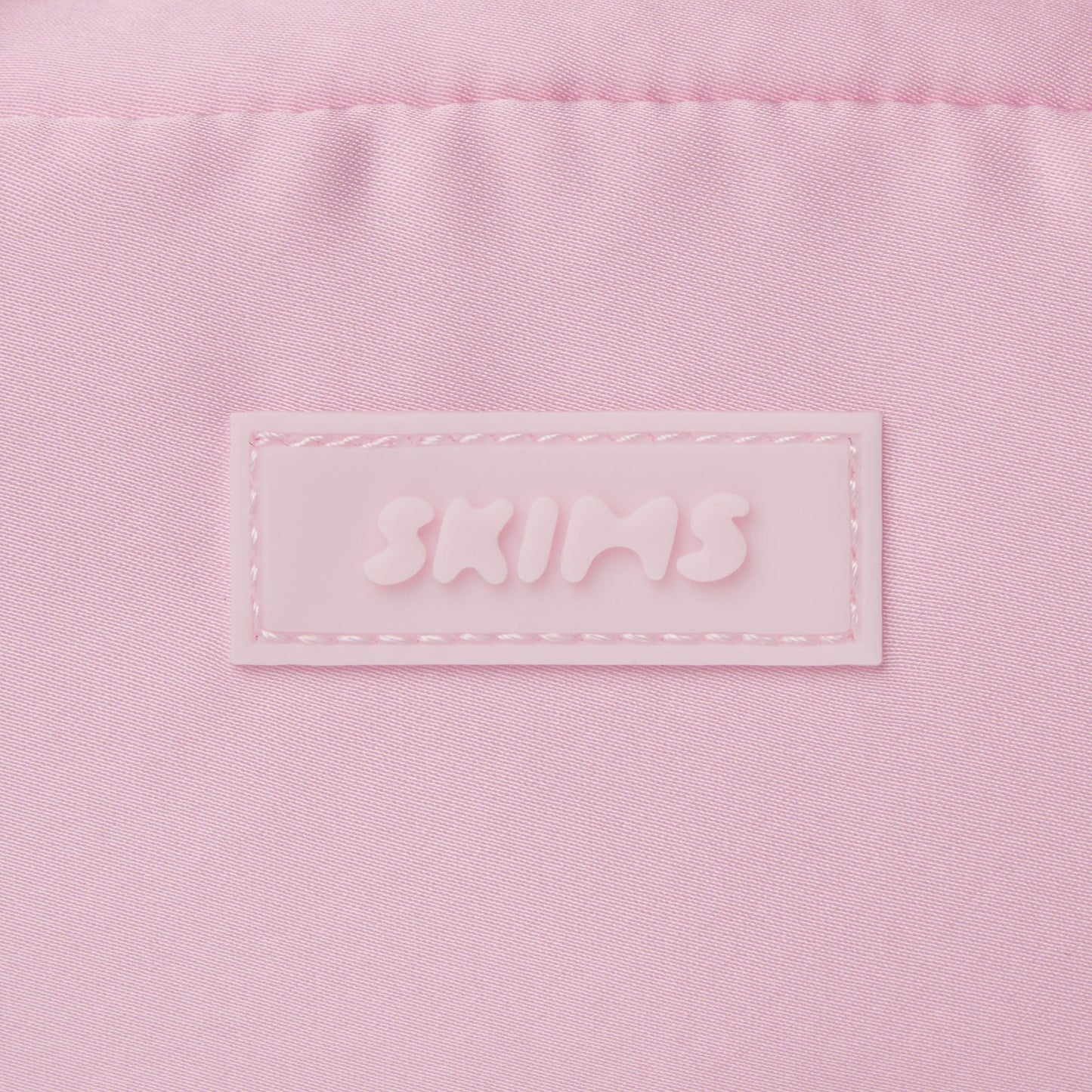 SKIMS ACCESSORIES SATIN MINI DUFFLE BAG | PEONY