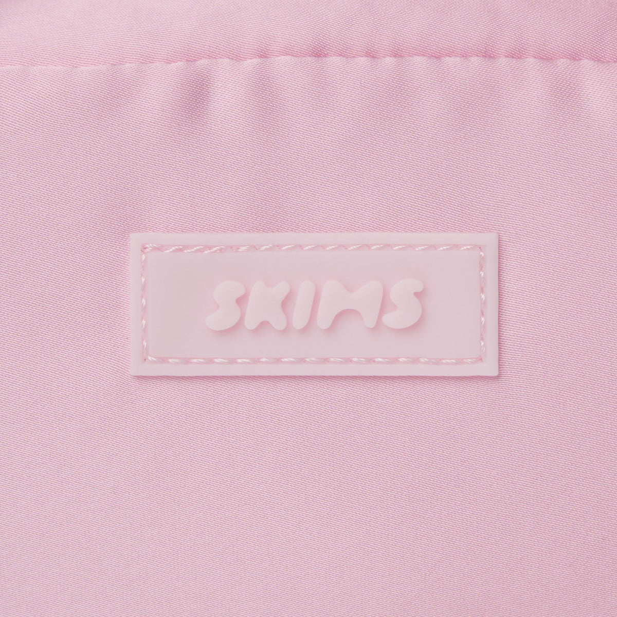 SKIMS ACCESSORIES SATIN MINI DUFFLE BAG | PEONY