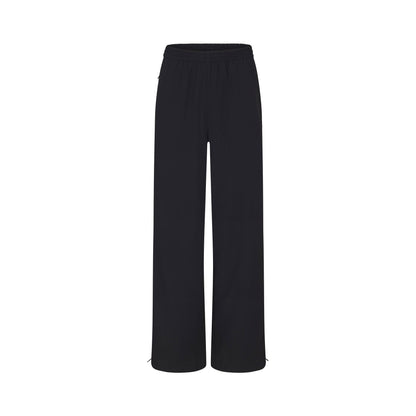 NikeSKIMS WOVEN NYLON OVERSIZED TRACK PANT | OBSIDIAN
