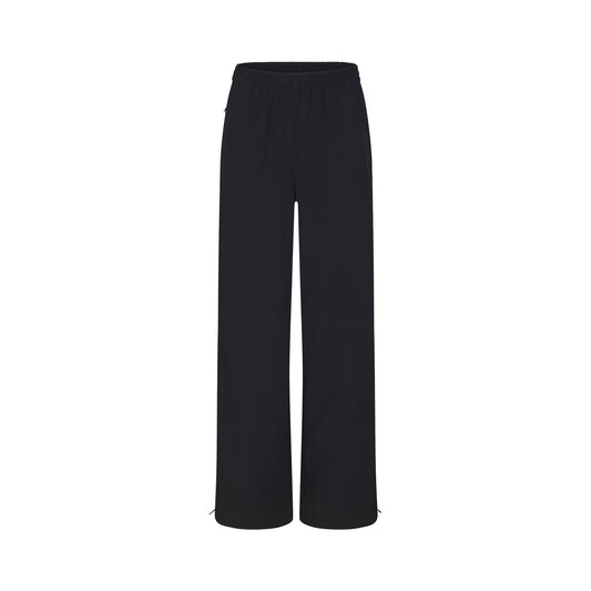 NikeSKIMS WOVEN NYLON OVERSIZED TRACK PANT | OBSIDIAN