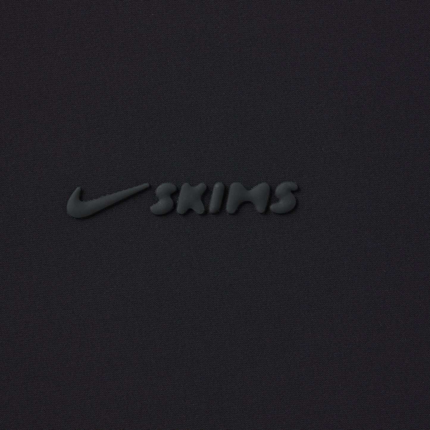 NikeSKIMS WOVEN NYLON OVERSIZED TRACK PANT | OBSIDIAN